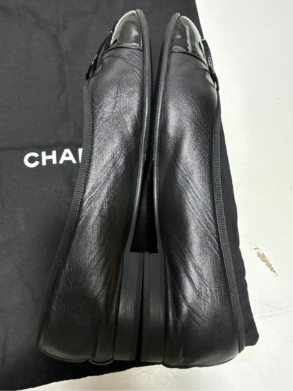 CHANEL Black Leather Cap-Toe Ballet Flats with CC Logo